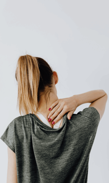 a woman massaging her neck from a flare up coping strategies